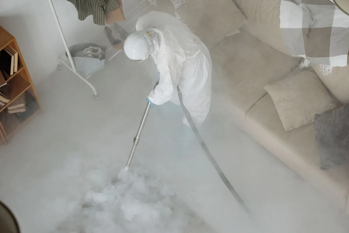 Biohazard cleanup technician in protective equipment, Wurtland, KY